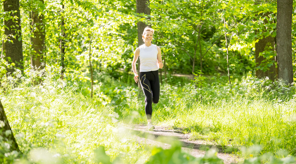 woman jogging in the forest