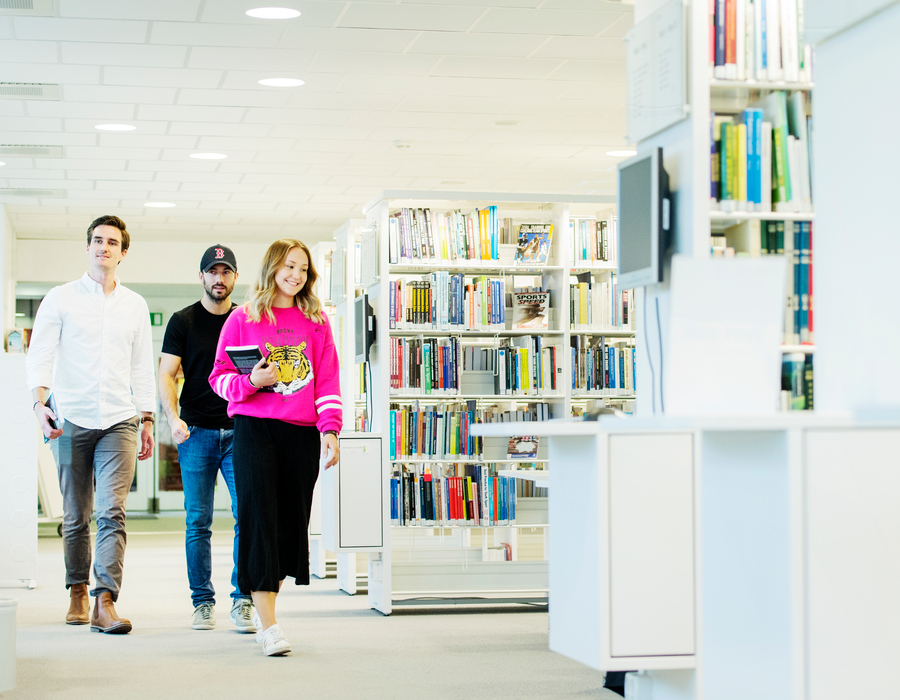Students walk through GIH library